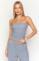 Model is wearing a navy and white horizontally striped strapless tube top paired with matching high-waisted- wide-leg striped pants.